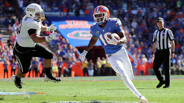 Nov 17, 2018; Gainesville, FL, USA; Florida Gators wide receiver Josh Hammond (10) runs the ball in for a touchdown as Idaho Vandals defensive lineman Cameron Townsend (93) attempts to defend during the second quarter at Ben Hill Griffin Stadium. Photo Credit: Kim Klement-USA TODAY Sports