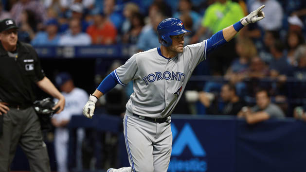 Apr 4, 2016; St. Petersburg, FL, USA; Toronto Blue Jays catcher Josh Thole (22) points and celebrates after hitting a home run during the third inning against the Tampa Bay Rays at Tropicana Field. Mandatory Credit: Kim Klement-USA TODAY Sports
