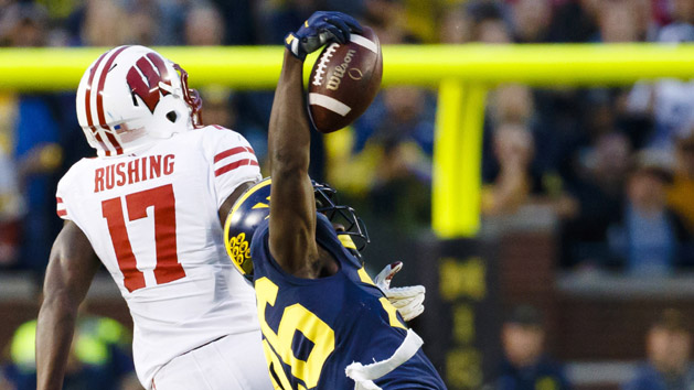 Oct 1, 2016; Ann Arbor, MI, USA; Michigan Wolverines cornerback Jourdan Lewis (26) intercepts a pass intended for Wisconsin Badgers wide receiver George Rushing (17) in the fourth quarter at Michigan Stadium. Michigan won 14-7. Photo Credit: Rick Osentoski-USA TODAY Sports