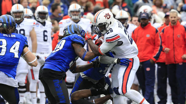 Dec 30, 2015; Birmingham, AL, USA; Memphis Tigers defensive back Chauncey Lanier (12) along with linebacker Darian Porter (29) tackles Auburn Tigers running back Jovon Robinson (29) in the 2015 Birmingham Bowl at Legion Field. Mandatory Credit: Marvin Gentry-USA TODAY Sports