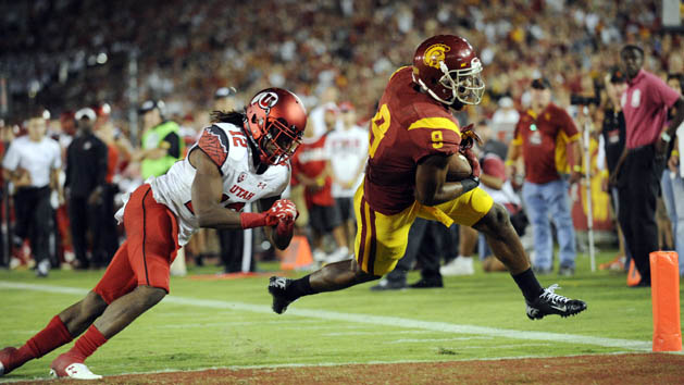 October 24, 2015; Los Angeles, CA, USA; Southern California Trojans wide receiver JuJu Smith-Schuster (9) moves in to score a touchdown ahead of Utah Utes defensive back Justin Thomas (12) during the second half at Los Angeles Memorial Coliseum. Mandatory Credit: Gary A. Vasquez-USA TODAY Sports