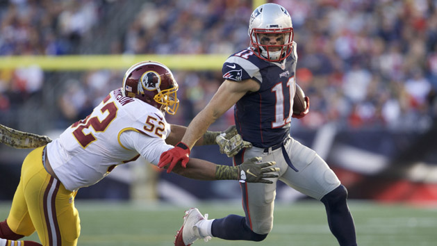 Julian Edelman (11) runs the ball against Washington Redskins inside linebacker Keenan Robinson (52) in the second half at Gillette Stadium last year. The Patriots defeated the Redskins 27-10. Photo Credit: David Butler II-USA TODAY Sports