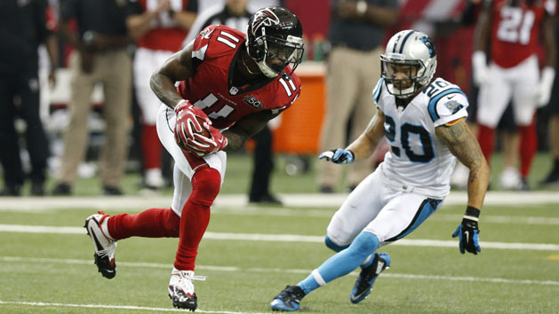 Dec 27, 2015; Atlanta, GA, USA; Atlanta Falcons wide receiver Julio Jones (11) carries the ball after a catch pursued by Carolina Panthers free safety Kurt Coleman (20) in the third quarter at the Georgia Dome. Mandatory Credit: Jason Getz-USA TODAY Sports