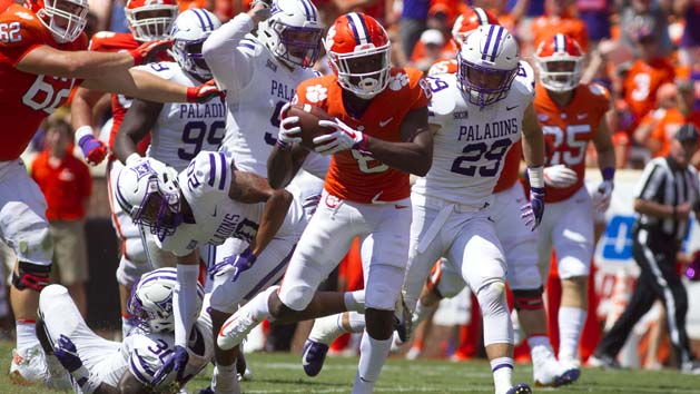 Sep 1, 2018; Clemson, SC, USA; Clemson Tigers wide receiver Justyn Ross (8) carries the ball for a touchdown while being defended by Furman Paladins linebacker Jordan Willis (30) and safety DiMarcus Clay (20) during the third quarter at Clemson Memorial Stadium. Photo Credit: Joshua S. Kelly-USA TODAY Sports