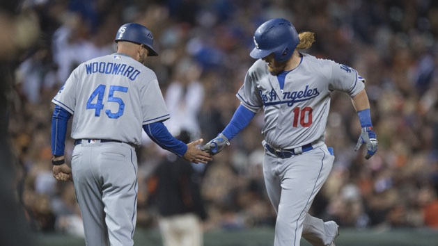 Jun 10, 2016; San Francisco, CA, USA; Los Angeles Dodgers third baseman Justin Turner (10) is congratulated by third base coach Chris Woodward (45) as he rounds the bases after a solo home run during the ninth inning against the San Francisco Giants at AT&T Park. Photo Credit: Kenny Karst-USA TODAY Sports