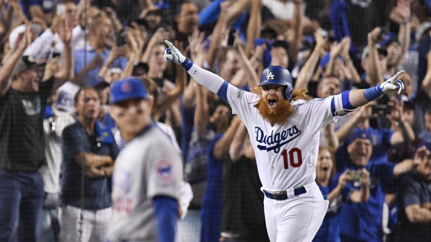 Oct 15, 2017; Los Angeles, CA, USA; Los Angeles Dodgers third baseman Justin Turner (10) runs home after hitting a three RBI home run against the Chicago Cubs in the ninth inning during game two of the 2017 NLCS playoff baseball series at Dodger Stadium. Photo Credit: Robert Hanashiro-USA TODAY Sports