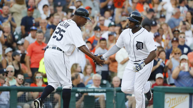 Detroit Tigers left fielder Justin Upton (8) receives congratulations from third base coach Dave Clark (25) after he hit a home run in the second inning against the Minnesota Twins at Comerica Park. Photo Credit: Rick Osentoski-USA TODAY Sports