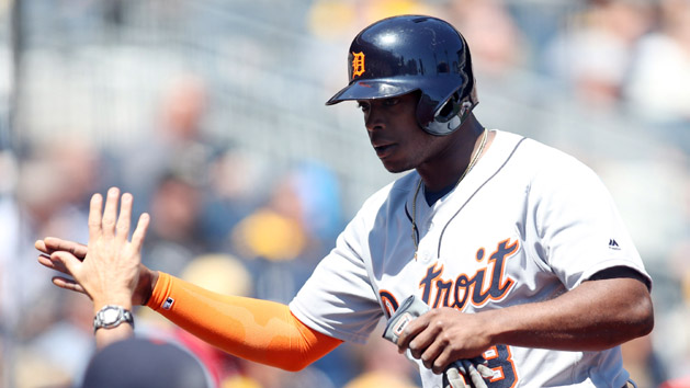 Apr 14, 2016; Pittsburgh, PA, USA; Detroit Tigers left fielder Justin Upton (8) receives a high-five at the dugout after scoring a run against the Pittsburgh Pirates during the fourth inning in an inter-league game at PNC Park. Mandatory Credit: Charles LeClaire-USA TODAY Sports