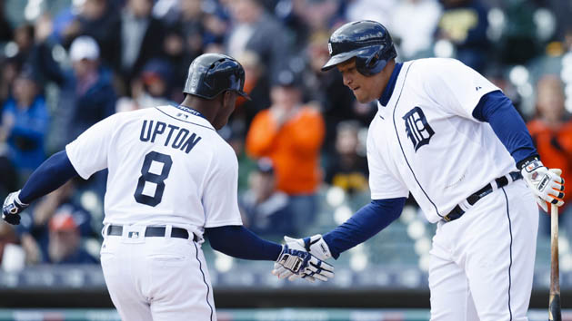 Apr 12, 2016; Detroit, MI, USA; Detroit Tigers left fielder Justin Upton (8) receives congratulations from first baseman Miguel Cabrera (24) after he hits a home run in the first inning against the Pittsburgh Pirates at Comerica Park. Mandatory Credit: Rick Osentoski-USA TODAY Sports