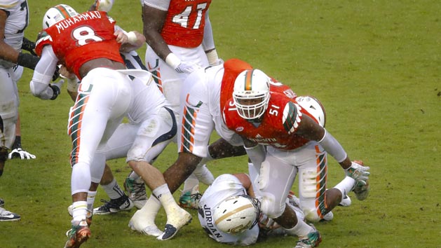 Nov 21, 2015; Miami Gardens, FL, USA; Miami Hurricanes linebacker Juwon Young (51) reacts after sacking Georgia Tech Yellow Jackets quarterback Matthew Jordan (11) during the second half at Sun Life Stadium. Photo Credit: Steve Mitchell-USA TODAY Sports