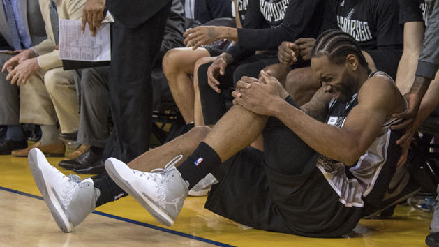May 14, 2017; Oakland, CA, USA; San Antonio Spurs forward Kawhi Leonard (2) reacts after an injury during the third quarter in game one of the Western conference finals of the 2017 NBA Playoffs against the Golden State Warriors at Oracle Arena. The Warriors defeated the Spurs 113-111. Photo Credit: Kyle Terada-USA TODAY Sports