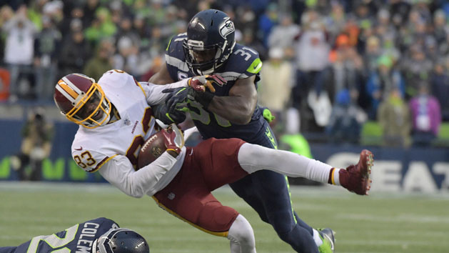 Nov 5, 2017; Seattle, WA, USA; Washington Redskins wide receiver Brian Quick (83) is tackled by Seattle Seahawks strong safety Kam Chancellor (31) in the fourth quarter during an NFL football game at CenturyLink Field. The Redskins defeated the Seahawks 17-14. Photo Credit: Kirby Lee-USA TODAY Sports