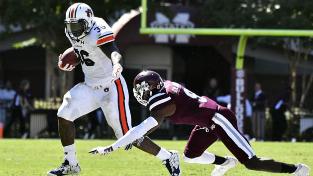 Oct 8, 2016; Starkville, MS, USA; Auburn Tigers running back Kamryn Pettway (36) runs the ball as he is defended by Mississippi State Bulldogs defensive back Jamoral Graham (9) during the second quarter of the game at Davis Wade Stadium. Photo Credit: Matt Bush-USA TODAY Sports