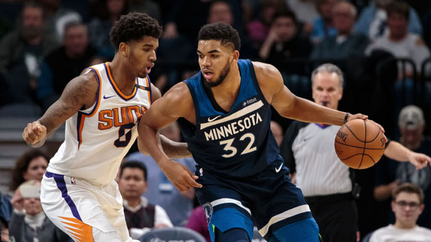 Nov 26, 2017; Minneapolis, MN, USA; Minnesota Timberwolves center Karl-Anthony Towns (32) dribbles in the third quarter against the Phoenix Suns forward Marquese Chriss (0) at Target Center. Photo Credit: Brad Rempel-USA TODAY Sports