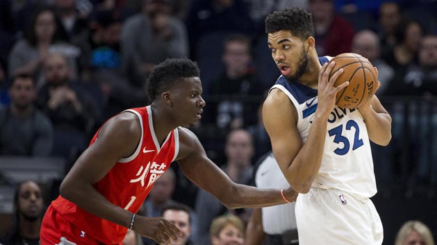 Feb 13, 2018; Minneapolis, MN, USA; Minnesota Timberwolves center Karl-Anthony Towns (32) looks to get around Houston Rockets forward Luc Mbah a Moute (12) in the first half at Target Center. Photo Credit: Jesse Johnson-USA TODAY Sports
