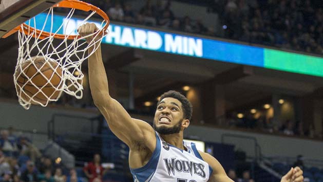 Apr 13, 2016; Minneapolis, MN, USA; Minnesota Timberwolves center Karl-Anthony Towns (32) dunks the ball in the second half against the New Orleans Pelicans at Target Center. The Timberwolves won 144-109. Mandatory Credit: Jesse Johnson-USA TODAY Sports