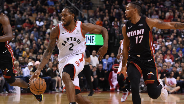 Nov 25, 2018; Toronto, Ontario, CAN; Toronto Raptors forward Kawhi Leonard (2) dribbles the ball past Miami Heat guard Rodney McGruder (17) in the second half at Scotiabank Arena. Photo Credit: Dan Hamilton-USA TODAY Sports