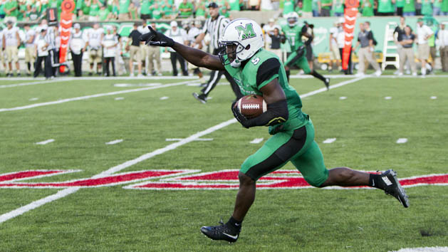 Sep 6, 2015; Huntington, WV, USA; Marshall Thundering Herd defensive back Keith Baxter (5) intercepts a pass late in the fourth quarter against the Purdue Boilermakers at Joan C. Edwards Stadium. Marshall won the game 41-31. Mandatory Credit: Ben Queen-USA TODAY Sports