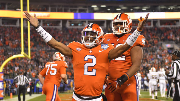 Dec 2, 2017; Charlotte, NC, USA; Clemson Tigers quarterback Kelly Bryant (2) celebrates with defensive lineman Christian Wilkins (42) after scoring a touchdown a touchdown in the first quarter in the ACC championship game at Bank of America Stadium. Photo Credit: Bob Donnan-USA TODAY Sports