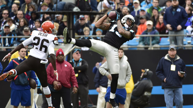 Dec 21, 2014; Charlotte, NC, USA; Carolina Panthers wide receiver Kelvin Benjamin (13) catches a pass as Cleveland Browns cornerback Pierre Desir (26) defends in the second quarter at Bank of America Stadium. (Bob Donnan-USA TODAY Sports)