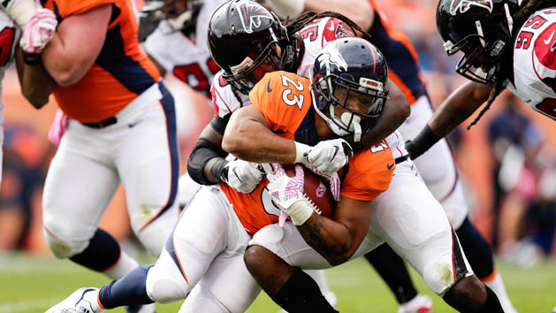 Oct 9, 2016; Denver, CO, USA; Denver Broncos running back Devontae Booker (23) is tackled by Atlanta Falcons strong safety Kemal Ishmael (36) in the second quarter at Sports Authority Field at Mile High. Photo Credit: Isaiah J. Downing-USA TODAY Sports