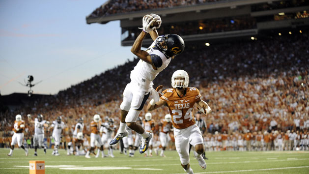 Sep 19, 2015; Austin, TX, USA; California Golden Bears wide receiver Kenny Lawler (left) catches a pass for a touchdown against Texas Longhorns corner back John Bonney (24) during the second quarter at Darrell K Royal-Texas Memorial Stadium. Mandatory Credit: Brendan Maloney-USA TODAY Sports