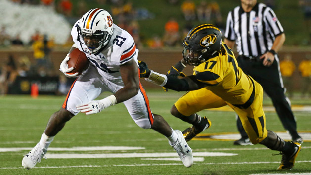 Sep 23, 2017; Columbia, MO, USA; Auburn Tigers running back Kerryon Johnson (21) runs against Missouri Tigers defensive back DeMarkus Acy (17) during the first half at Faurot Field. Photo Credit: Jay Biggerstaff-USA TODAY Sports