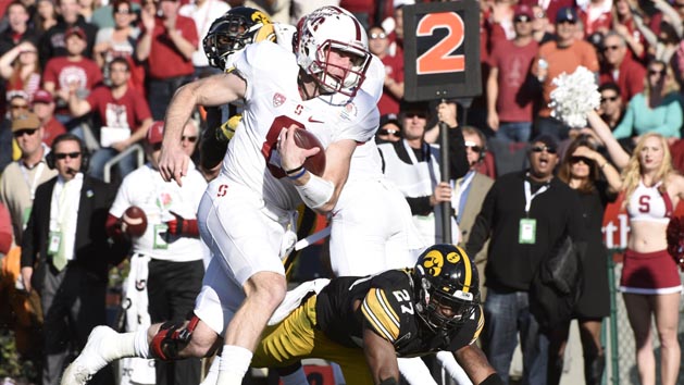 Jan 1, 2016; Pasadena, CA, USA; Stanford Cardinal quarterback Kevin Hogan (8) runs for a touchdown against the Iowa Hawkeyes during the first quarter in the 2016 Rose Bowl at Rose Bowl. Mandatory Credit: Richard Mackson-USA TODAY Sports