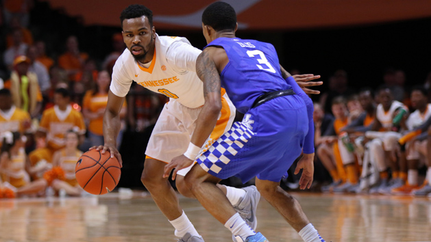 Feb 2, 2016; Knoxville, TN, USA; Tennessee Volunteers guard Kevin Punter (0) brings the ball up court against Kentucky Wildcats guard Tyler Ulis (3) during the first half at Thompson-Boling Arena. Mandatory Credit: Randy Sartin-USA TODAY Sports
