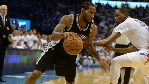 May 6, 2016; Oklahoma City, OK, USA; San Antonio Spurs forward Kawhi Leonard (2) drives to the basket in front of Oklahoma City Thunder forward Kevin Durant (35) during the fourth quarter in game three of the second round of the NBA Playoffs at Chesapeake Energy Arena. Mandatory Credit: Mark D. Smith-USA TODAY Sports