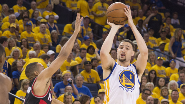 May 1, 2016; Oakland, CA, USA; Golden State Warriors guard Klay Thompson (11) shoots the basketball against Portland Trail Blazers guard C.J. McCollum (3) during the third quarter in game one of the second round of the NBA Playoffs at Oracle Arena. The Warriors defeated the Trail Blazers 118-106. Mandatory Credit: Kyle Terada-USA TODAY Sports