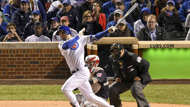 Oct 30, 2016; Chicago, IL, USA; Chicago Cubs third baseman Kris Bryant (left) hits a solo home run against Cleveland Indians catcher Roberto Perez (center) during the fourth inning in game five of the 2016 World Series at Wrigley Field. Photo Credit: Tommy Gilligan-USA TODAY Sports