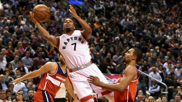 Jan 26, 2016; Toronto, Ontario, CAN; Toronto Raptors guard Kyle Lowry (7) drives to the basket and is fouled by Washington Wizards guard Ramon Sessions (7) in the fourth quarter of the Raptors 106-89 victory at Air Canada Centre. Mandatory Credit: Dan Hamilton-USA TODAY Sports