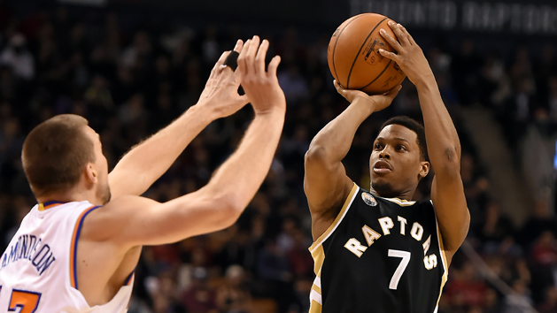 Jan 28, 2016; Toronto, Ontario, CAN; Toronto Raptors guard Kyle Lowry (7) shoots for a basket over New York Knicks forward Lou Amundson (17) during the second half of the Raptors 103-93 win at Air Canada Centre. Mandatory Credit: Dan Hamilton-USA TODAY Sports