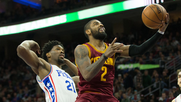 Nov 27, 2016; Philadelphia, PA, USA; Cleveland Cavaliers guard Kyrie Irving (2) scores past Philadelphia 76ers center Joel Embiid (21) during the fourth quarter at Wells Fargo Center. Photo Credit: Bill Streicher-USA TODAY Sports