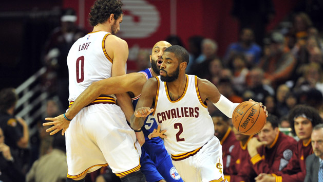 Dec 20, 2015; Cleveland, OH, USA; Cleveland Cavaliers guard Kyrie Irving (2) drives off the pick of Cleveland Cavaliers forward Kevin Love (0) as Philadelphia 76ers guard Kendall Marshall (5) defends during the first quarter at Quicken Loans Arena. Mandatory Credit: Ken Blaze-USA TODAY Sports