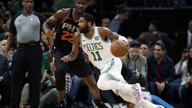 Dec 19, 2018; Boston, MA, USA; Boston Celtics guard Kyrie Irving (11) drives past Phoenix Suns center Deandre Ayton (22) during the first quarter at TD Garden. Photo Credit: Winslow Townson-USA TODAY Sports