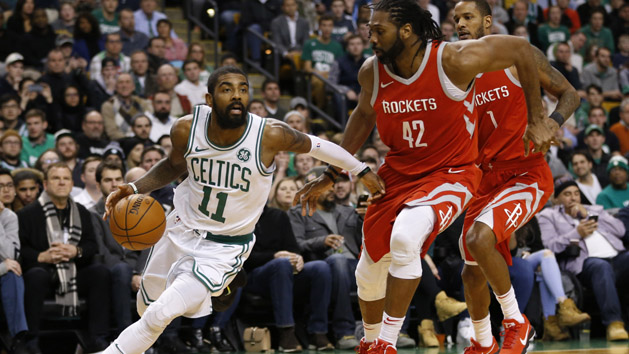 Dec 28, 2017; Boston, MA, USA; Boston Celtics guard Kyrie Irving (11) drives past Houston Rockets forward Nene (42) and guard Trevor Ariza (1) during the second half at TD Garden. Photo Credit: Greg M. Cooper-USA TODAY Sports