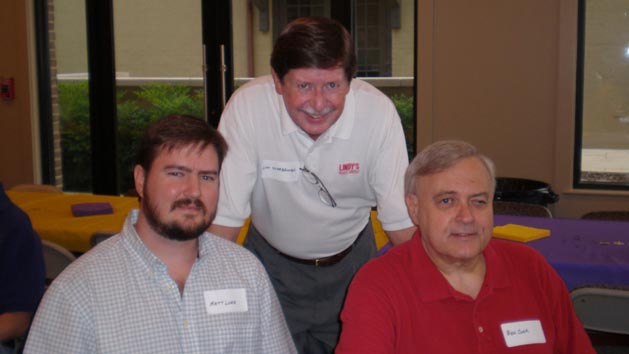 Ben Cook (right) with Lindy's staff members Matt Lowe (left) and Lyn Scarbrough (middle) at an LSU Alumni Kickoff event.