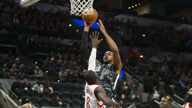 Nov 10, 2018; San Antonio, TX, USA; San Antonio Spurs forward LaMarcus Aldridge (12) goes up for a jump shot over Houston Rockets forward James Ennis III (8) during the first quarter at AT&T Center. Photo Credit: John Glaser-USA TODAY Sports