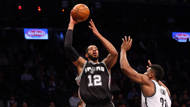 Jan 11, 2016; Brooklyn, NY, USA; San Antonio Spurs forward LaMarcus Aldridge (12) shoots over Brooklyn Nets forward Thaddeus Young (30) during the third quarter at Barclays Center. San Antonio Spurs won 106-79. Mandatory Credit: Anthony Gruppuso-USA TODAY Sports