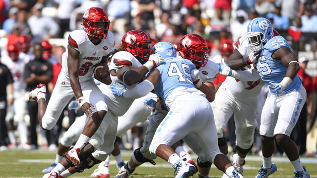 Sep 9, 2017; Chapel Hill, NC, USA; Louisville Cardinals quarterback Lamar Jackson (8) runs for a touchdown as North Carolina Tar Heels defensive tackle Jeremiah Clarke (49) and North Carolina Tar Heels defensive lineman Jason Strowbridge (55) defend in the fourth quarter. The Cardinals defeated the Tar Heels 47-35 at Kenan Memorial Stadium. Photo Credit: Bob Donnan-USA TODAY Sports
