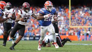 Gators use ground game to rally past Gamecocks