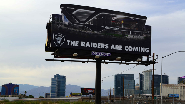 May 31, 2017; Paradise, NV, USA: General overall view of billboard that reads "The Raiders Are Coming" at the construction site of Las Vegas Stadium. The domed stadium will be the home of the Las Vegas Raiders and the UNLV Rebels football team. It is located on about 62 acres west of Mandalay Bay at Russell Road and Hacienda Avenue and between Polaris Avenue and Dean Martin Drive, just west of Interstate 15. Construction of the $1.9 billion stadium is planned to begin in 2017 and be completed for the 2020 NFL season. NFL owners voted 31-1 to allow Raiders owner Mark Davis to relocate the franchise from Oakland to Las Vegas. Photo Credit: Kirby Lee-USA TODAY Sports