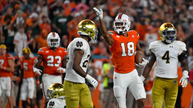 Nov 11, 2017; Miami Gardens, FL, USA; Miami Hurricanes wide receiver Lawrence Cager (18) signals for a first down after running the ball against the Notre Dame Fighting Irish during the first half at Hard Rock Stadium. Photo Credit: Jasen Vinlove-USA TODAY Sports