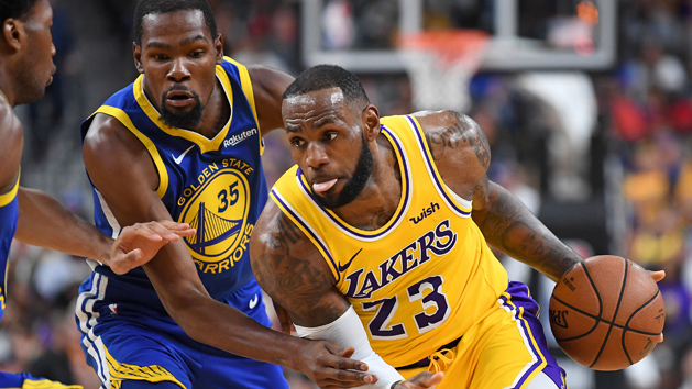 Oct 10, 2018; Las Vegas, NV, USA; Los Angeles Lakers forward LeBron James (23) dribbles against the defense of Golden State Warriors forward Kevin Durant (35) during the first half at T-Mobile Arena. Photo Credit: Stephen R. Sylvanie-USA TODAY Sports