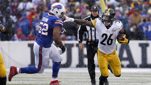 Dec 11, 2016; Orchard Park, NY, USA; Pittsburgh Steelers running back Le'Veon Bell (26) runs the ball and tries to block Buffalo Bills inside linebacker Preston Brown (52) during the second half at New Era Field. Pittsburgh beat Buffalo 27-20. Photo Credit: Timothy T. Ludwig-USA TODAY Sports