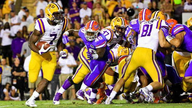 Oct 17, 2015; Baton Rouge, LA, USA; LSU Tigers running back Leonard Fournette (7) receives the snap from the shotgun and runs for a touchdown against the Florida Gators during the second quarter of a game at Tiger Stadium. Mandatory Credit: Derick E. Hingle-USA TODAY Sports