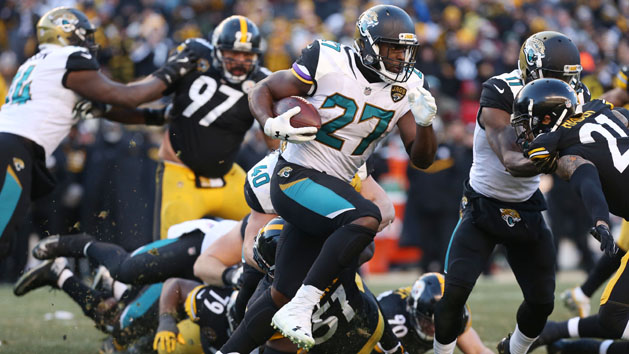 Jan 14, 2018; Pittsburgh, PA, USA; Jacksonville Jaguars running back Leonard Fournette (27) carries the ball past Pittsburgh Steelers linebacker Sean Spence (51) during the fourth quarter in the AFC Divisional Playoff game at Heinz Field. Photo Credit: Geoff Burke-USA TODAY Sports