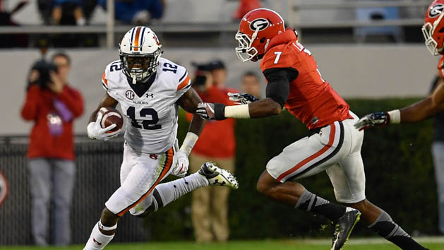 Nov 12, 2016; Athens, GA, USA; Auburn Tigers wide receiver Eli Stove (12) runs against Georgia Bulldogs linebacker Lorenzo Carter (7) during the second half at Sanford Stadium. Georgia defeated Auburn 13-7. Photo Credit: Dale Zanine-USA TODAY Sports